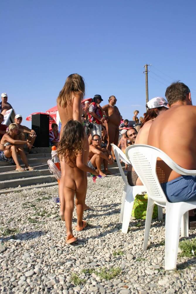 Naturist Standing Sideline - Engaging in naturism promotes inner harmony and peace of mind
