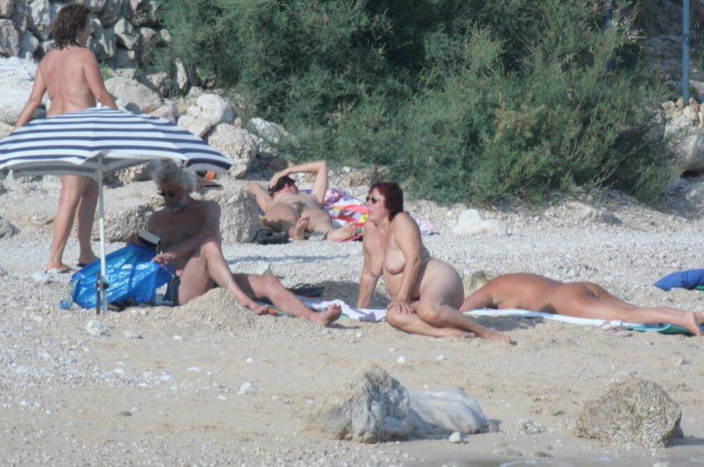 Croatian Baska Beach pics - A defining feature of naturism is the absence of clothing