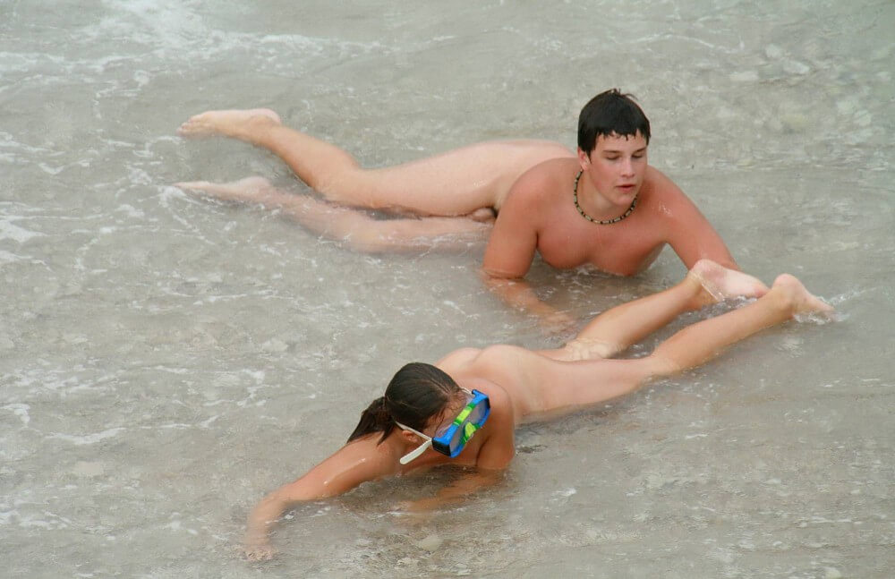 Wading In The Shallows pics - A defining feature of naturism is the absence of clothing