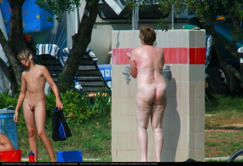 Covered in Towel Nudists-Boardwalk Biking - Naturists view nudity as a philosophy of life