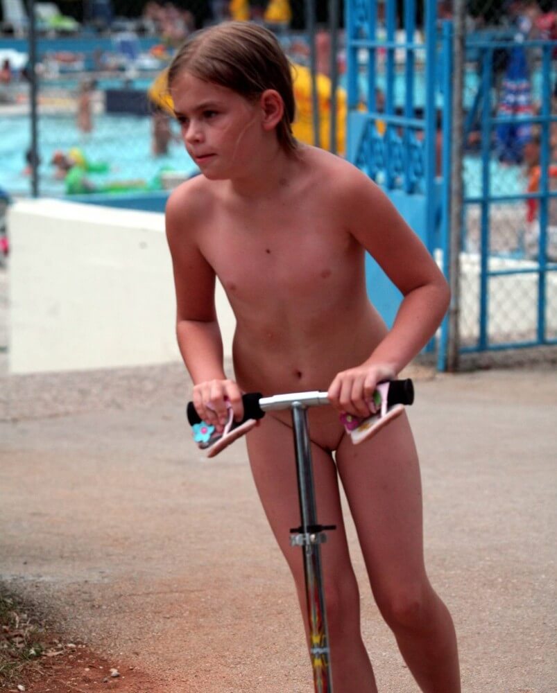 Pool-Side Naturist Scooter pics - A closed community of naturists