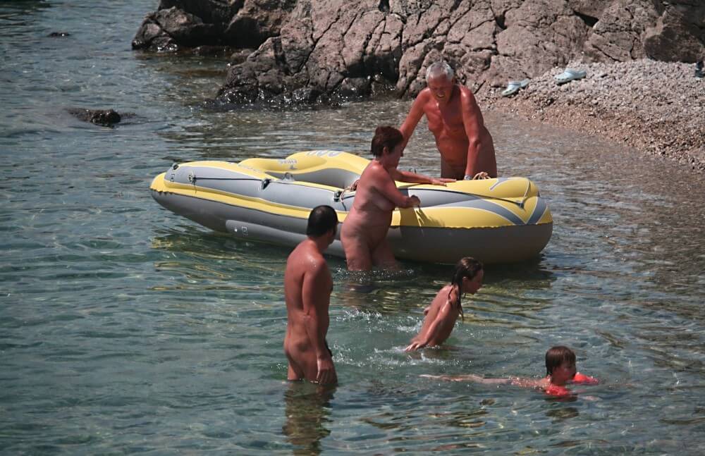 Lone Nudist in Yellow Boat photos - The foundations of naturist philosophy