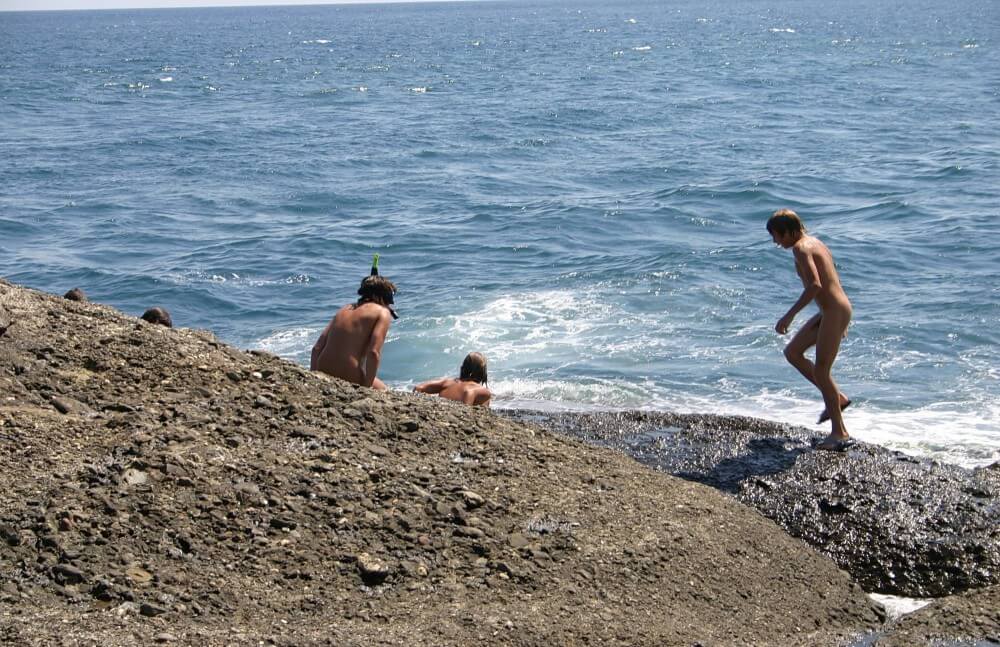 Leaning Against Hit Rocks pics - Naturalness and freedom go hand in hand with naturism